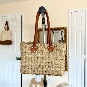 Straw tote with brown leather handles